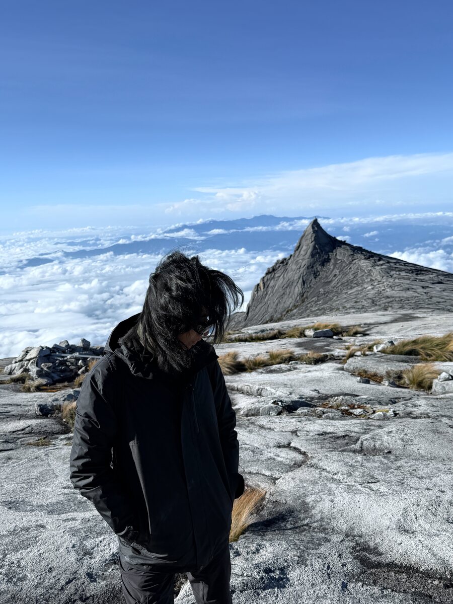 Jona Lim on a mountain ridge